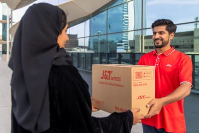 A_J_T_Express_courier_delivers_a_parcel_to_a_resident_in_Saudi_Arabia.jpg